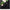 Black curtain panel close-up showing back tab header design and smooth fabric