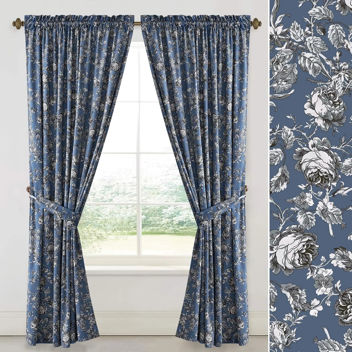 Blue floral curtain panels with gathered tops and matching tiebacks on a window