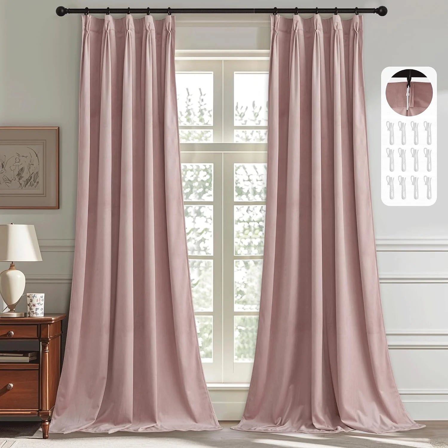 Blush pink velvet pinched pleat curtains on a black rod in a bright bedroom