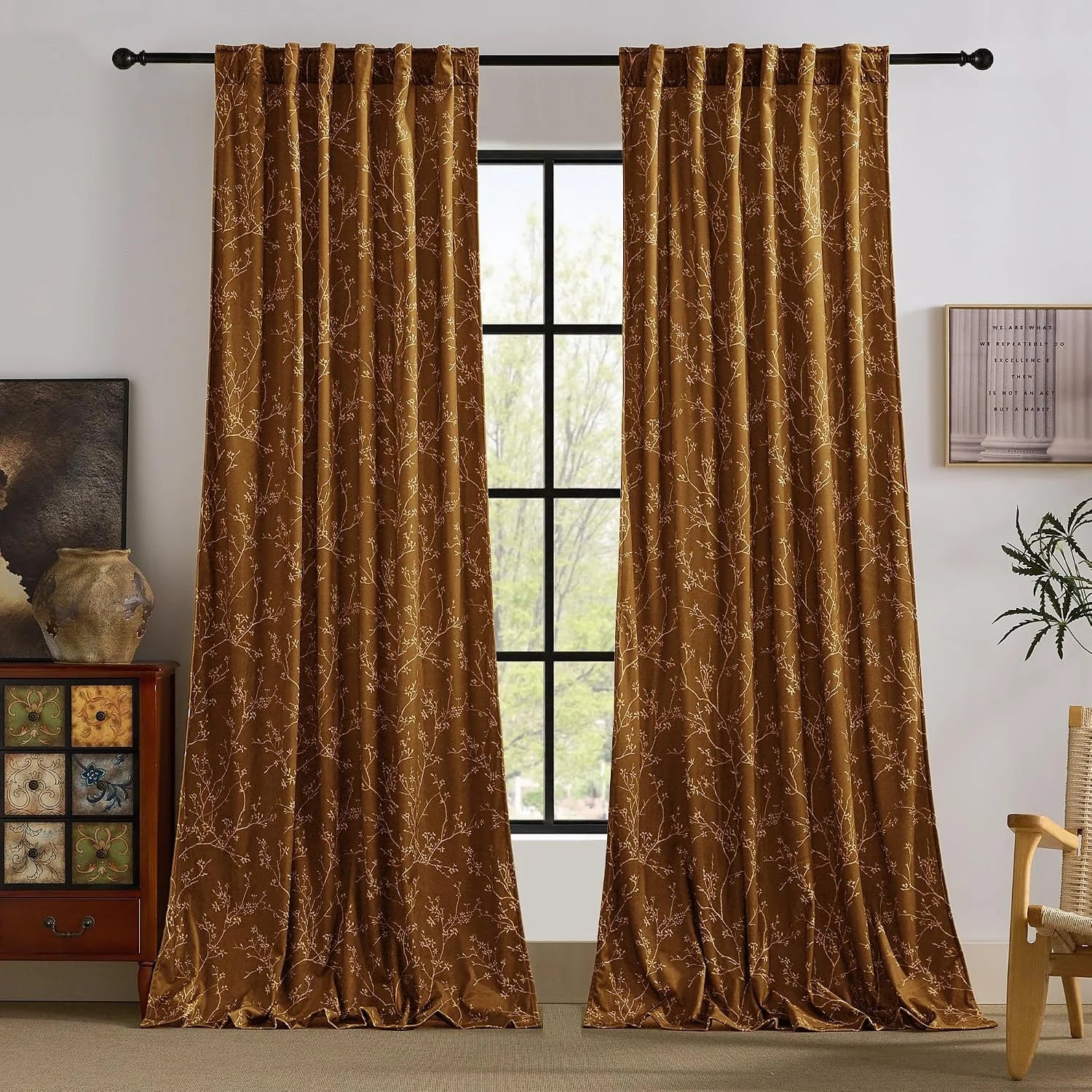 Brown botanical jacquard curtains with leafy vine pattern on a black rod