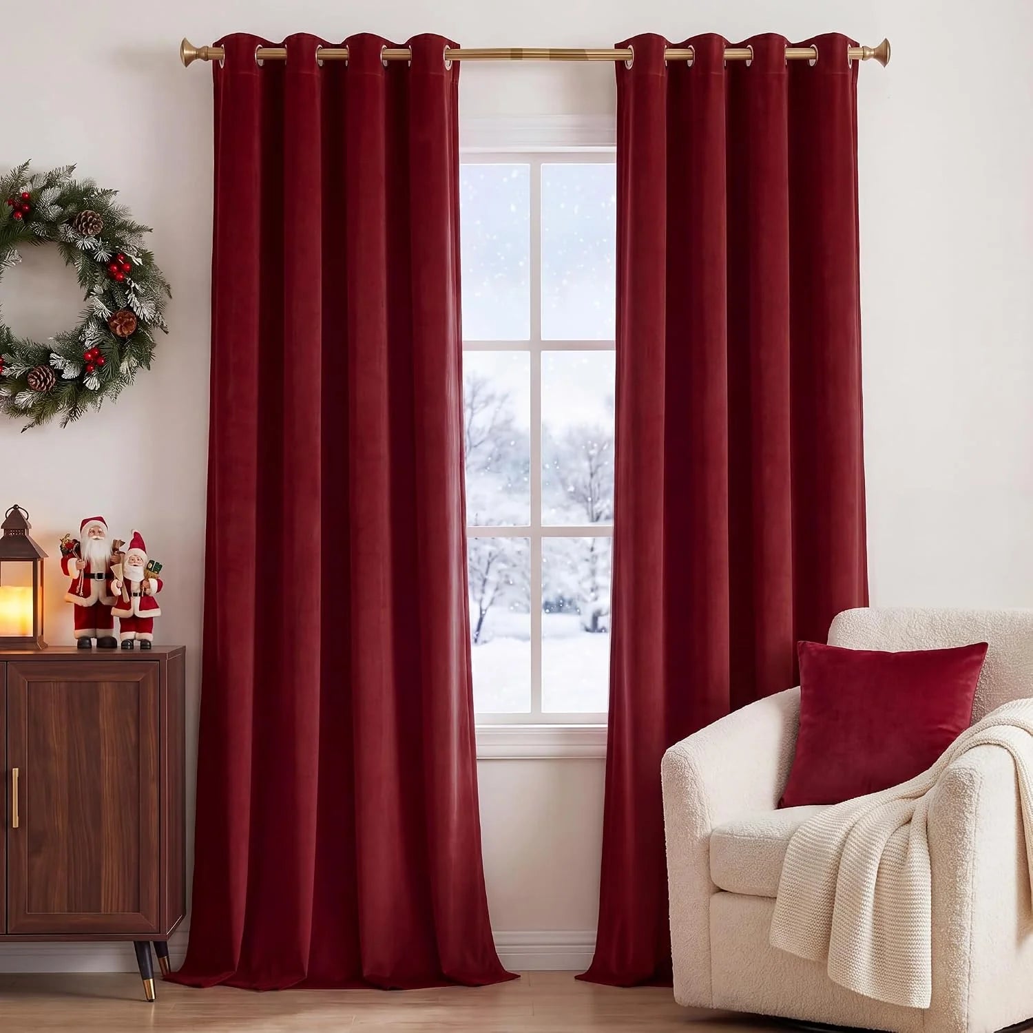 Burgundy velvet grommet curtains on a gold rod in a cozy festive living room