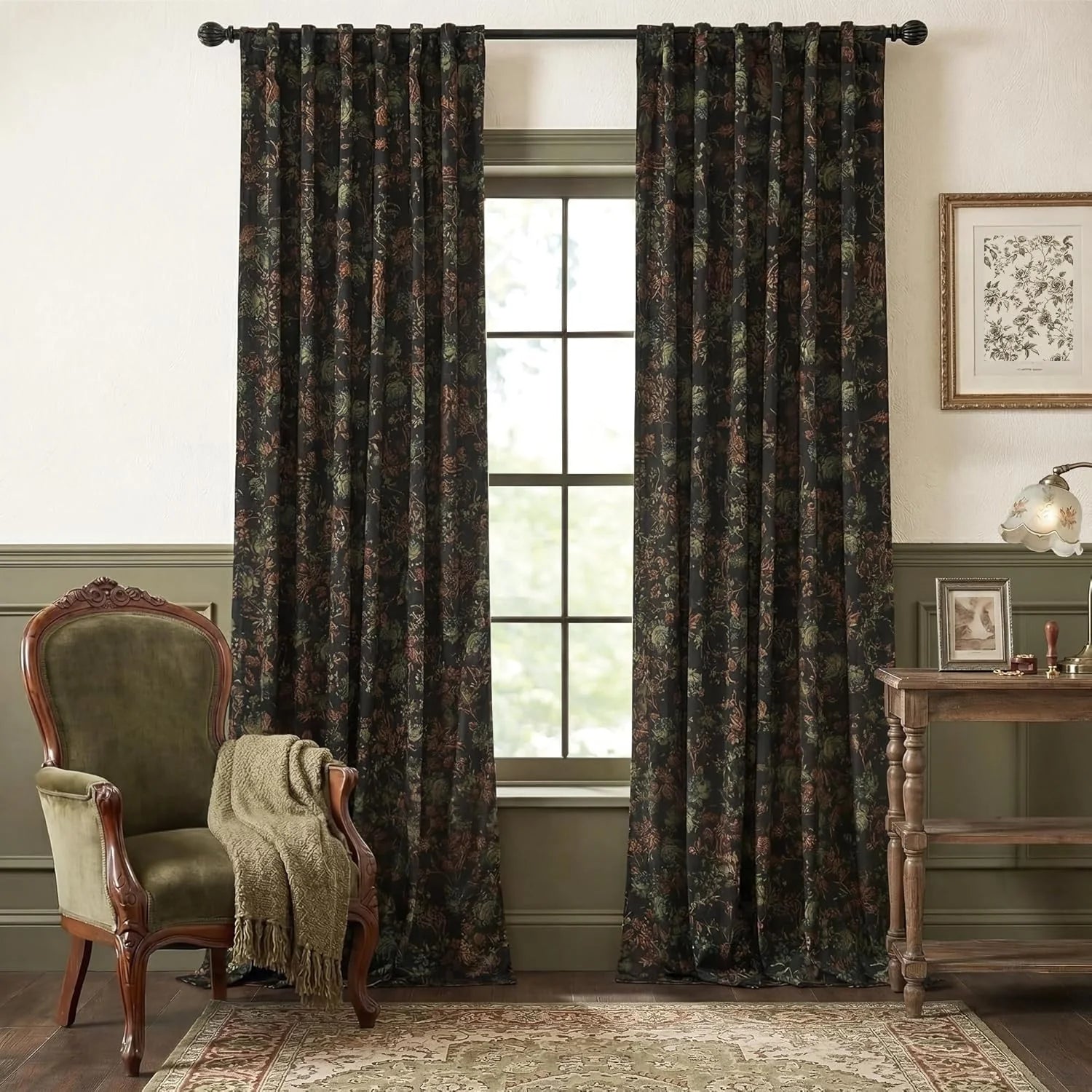 Dark botanical patterned curtains on a black rod in a vintage styled living room