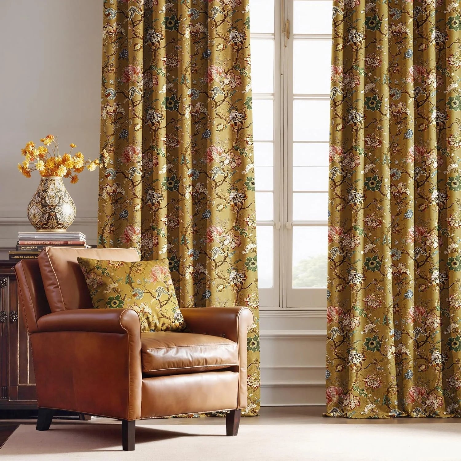 Gold floral botanical curtains in a classic living room with a tan leather armchair