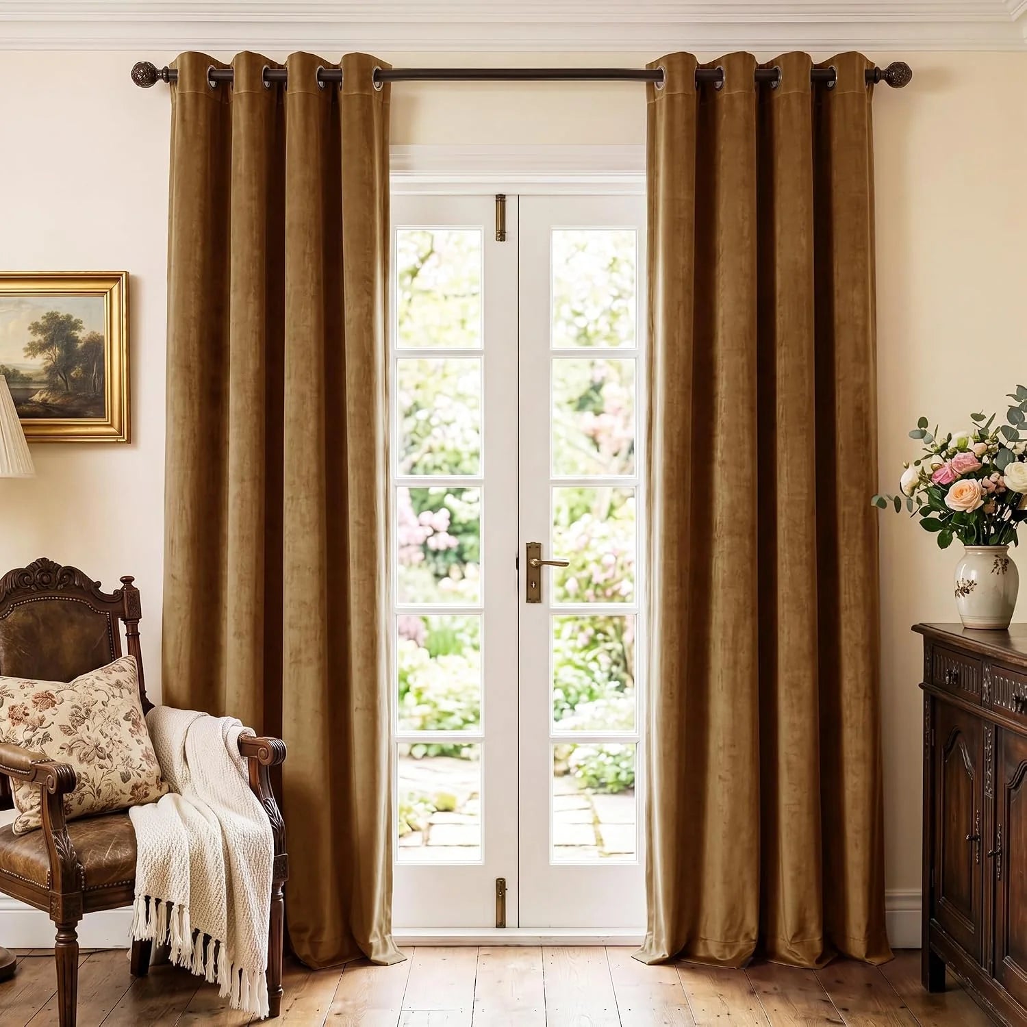Gold velvet grommet curtains framing French doors in a warm traditional room