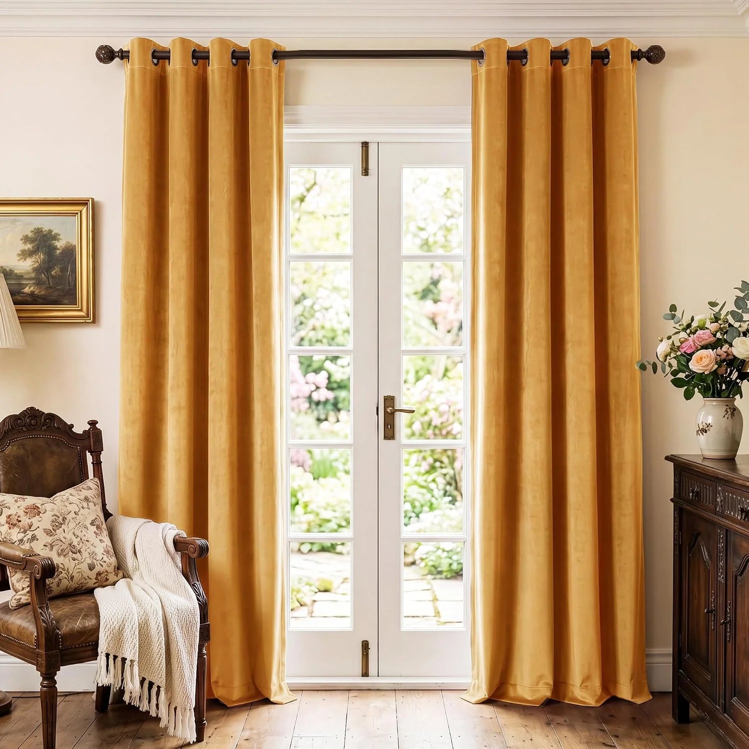 Gold velvet grommet curtains framing white French doors in a classic living room