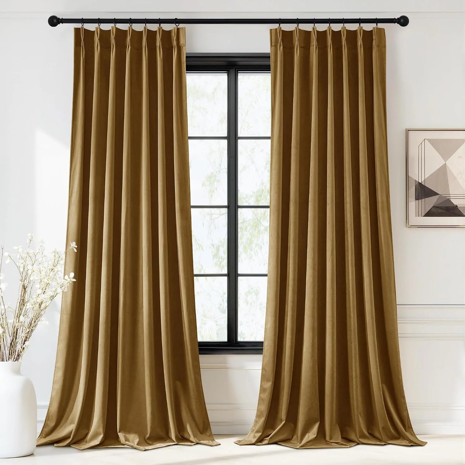 Gold velvet pleated curtains on a black rod framing a modern black window