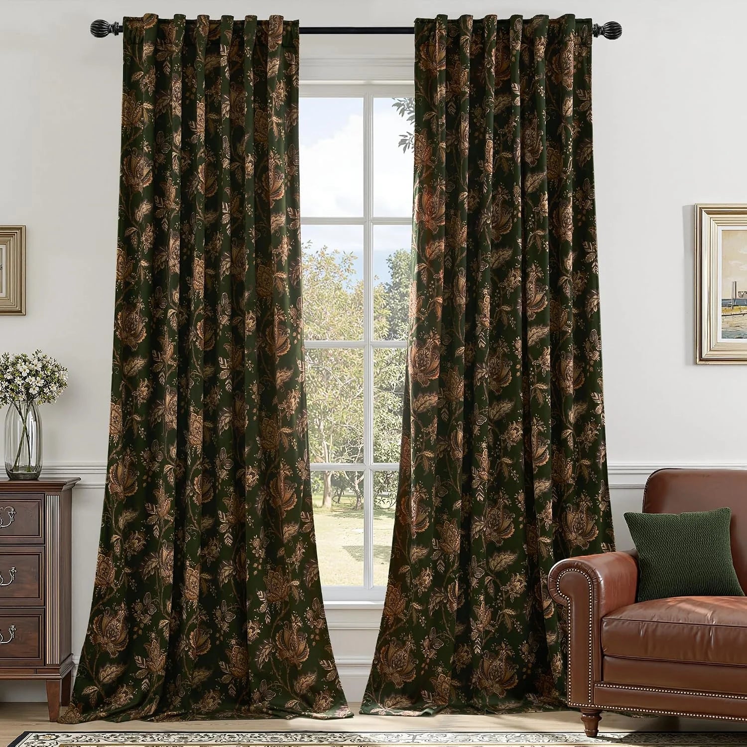 Dark green floral curtains with bronze pattern hanging in a traditional living room