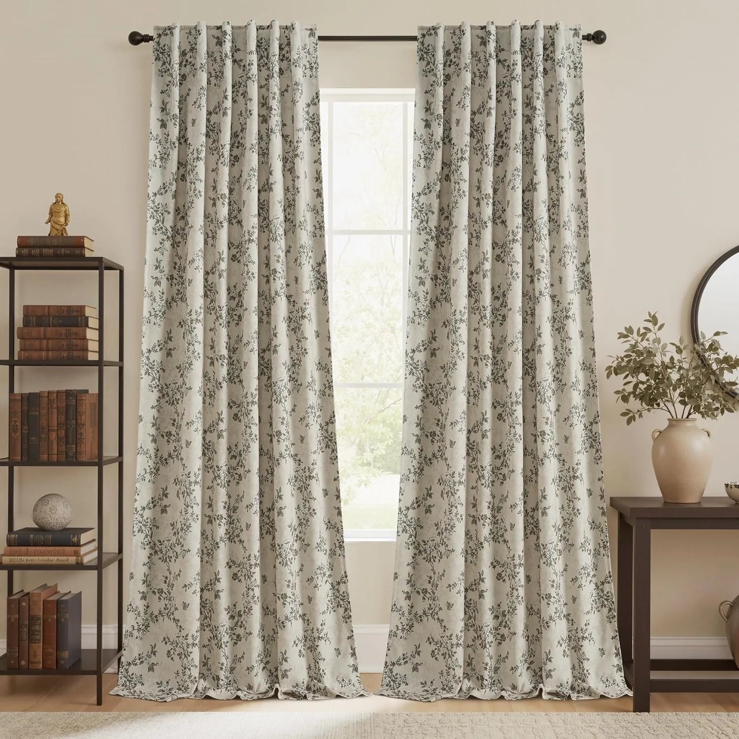 Ivory floral botanical curtains on a black rod in a warm neutral farmhouse room