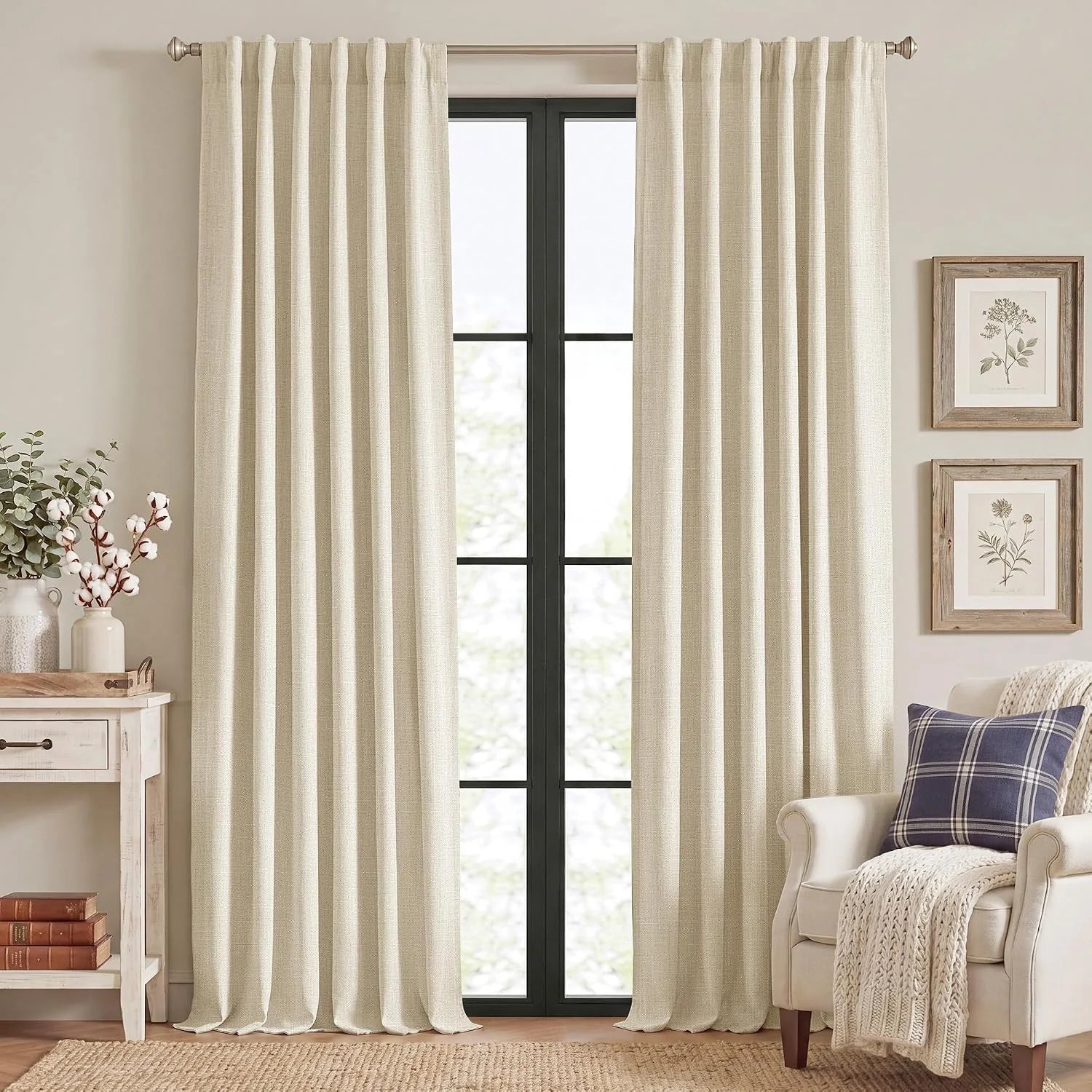 Ivory textured linen-look curtains hanging in a bright neutral farmhouse living room