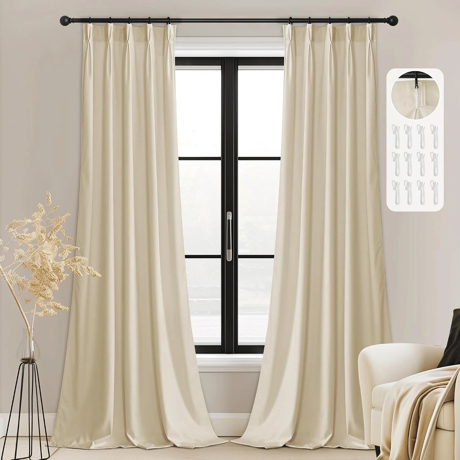 Ivory pinched pleat curtains on a black rod framing a modern black window