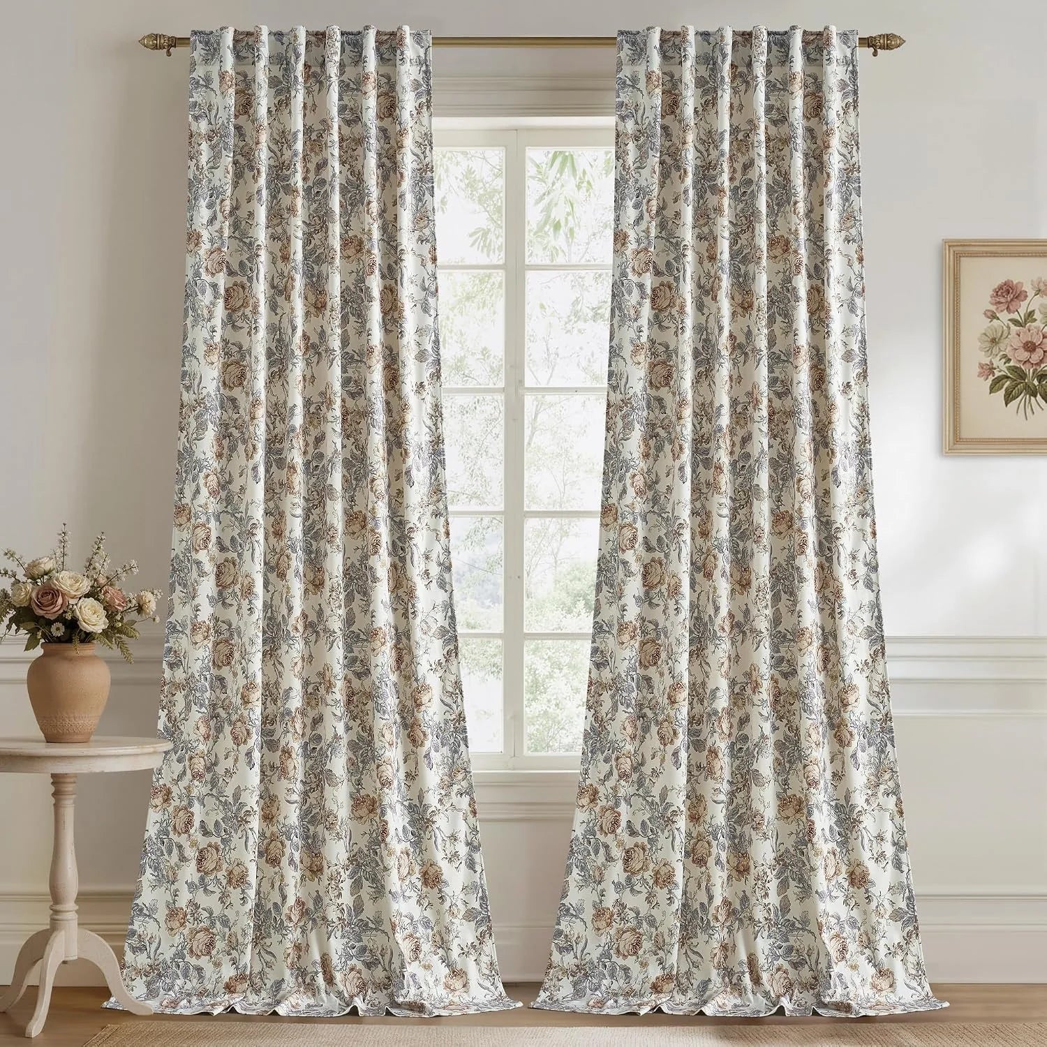 Ivory floral curtains with muted blue and beige rose print in a classic room