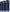 Close-up of navy velvet curtain panels with silver grommets on a brass rod