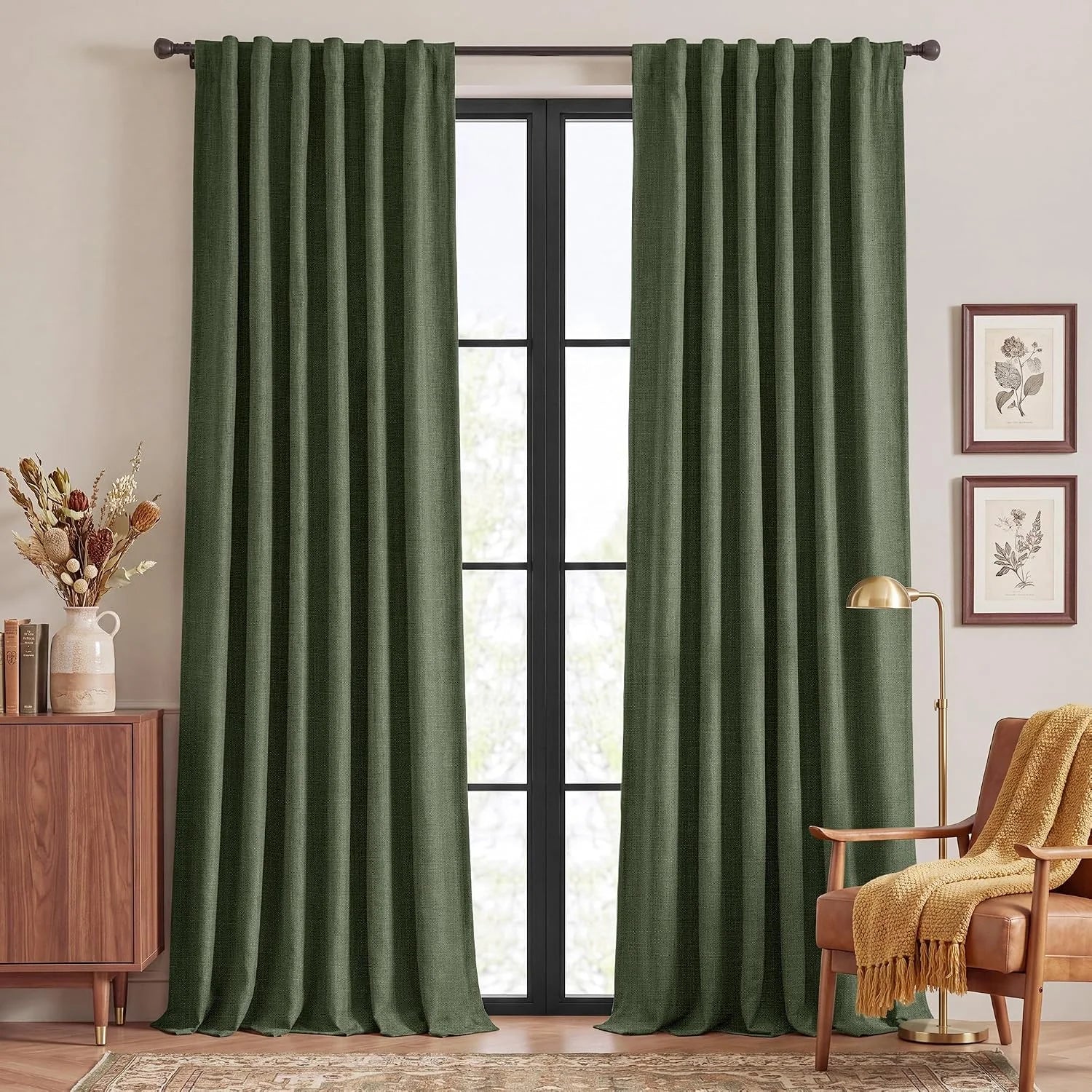 Olive green linen-look pleated curtains hanging in a cozy modern living room