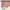 Pink floral window valance with ruffled rod pocket and scalloped hem