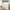 Sage green floral window valance above a bright cottage-style window with vintage decor