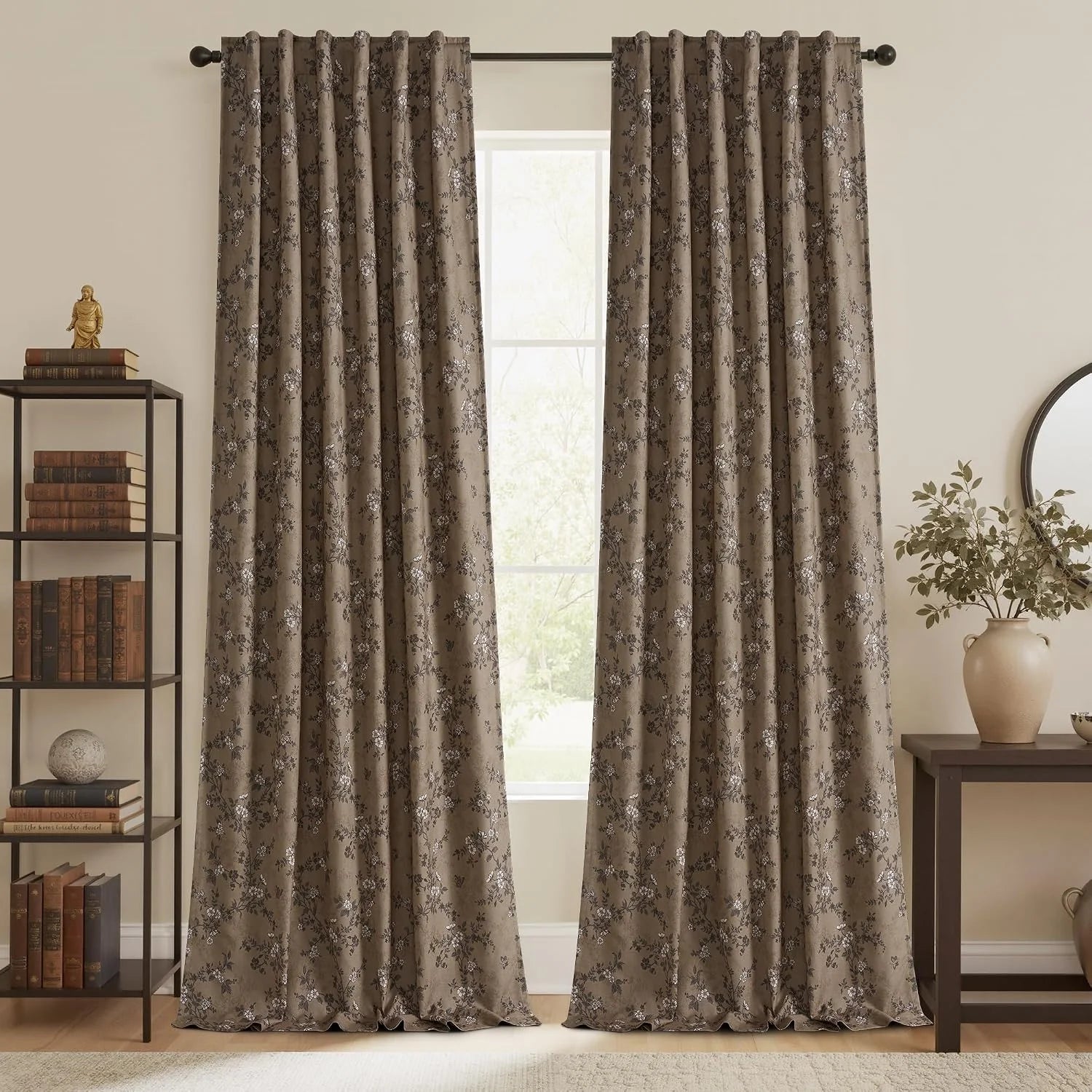 Taupe floral blackout curtains on a dark rod in a warm traditional living room