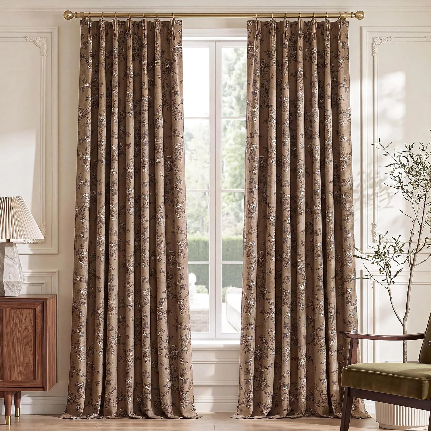 Taupe floral jacquard curtains on a gold rod in an elegant neutral living room