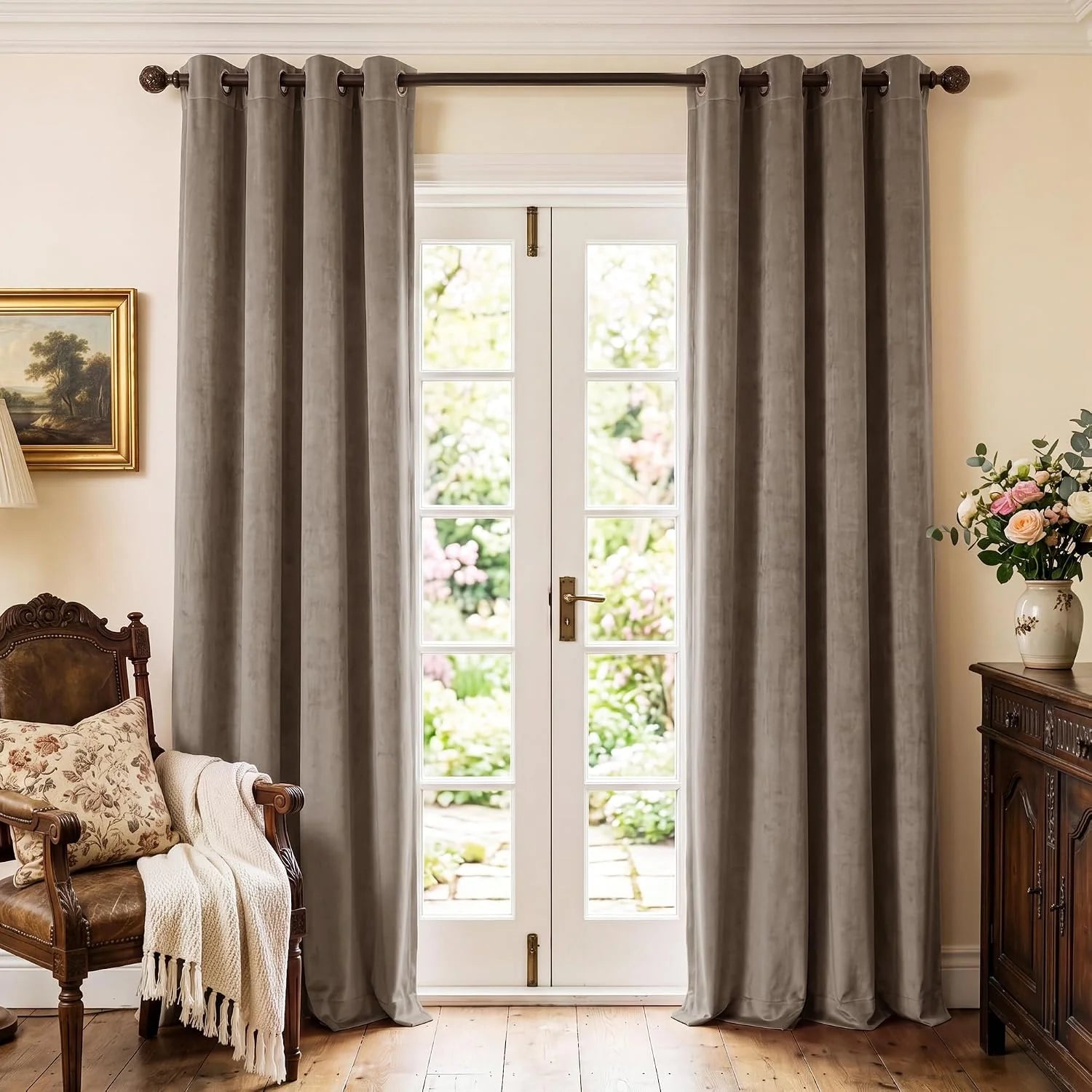 Taupe velvet grommet curtains framing white French doors in a traditional room