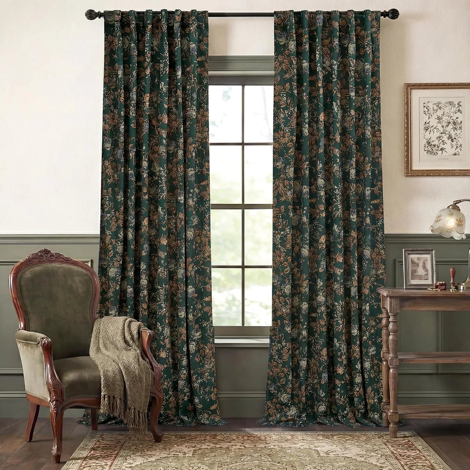 Dark teal botanical print curtains in a vintage living room with wood furniture