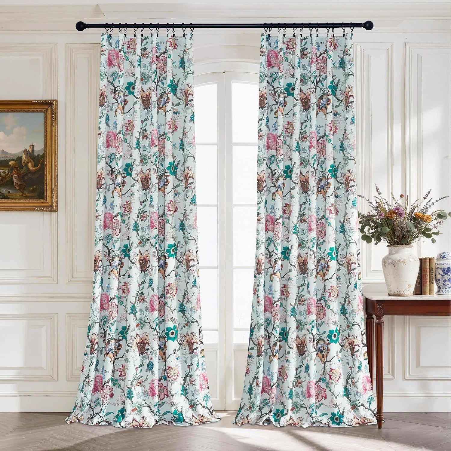 White floral botanical curtains with pink and teal pattern on black rod in classic room